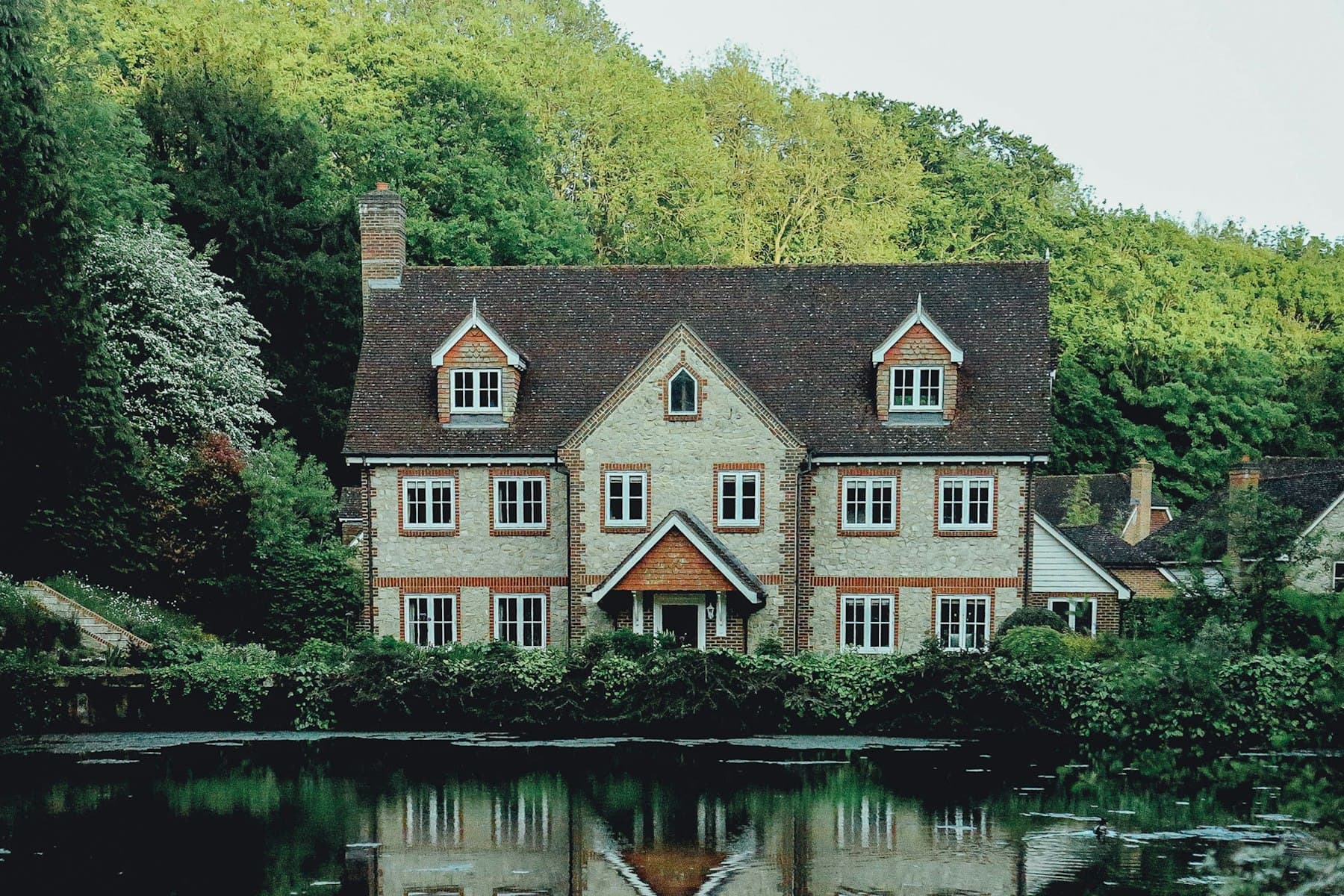 White historic-style house with dark shutters, similar to older Loudoun homes