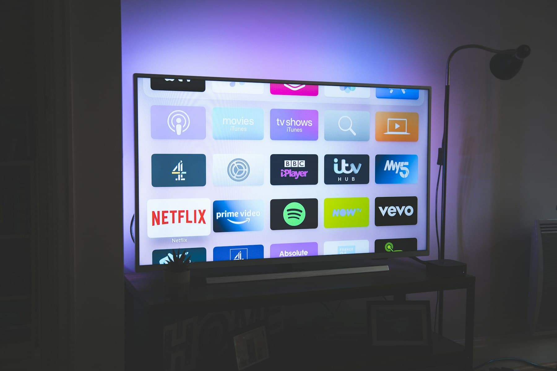 Living room with a wall-mounted television above a media console